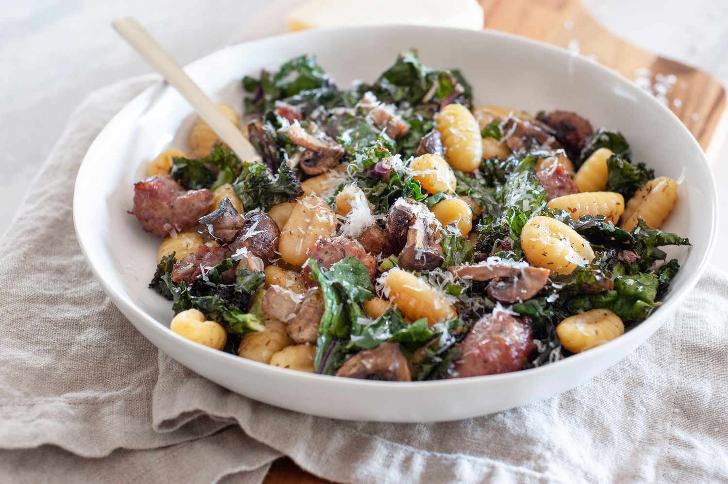Sheet Pan Gnocchi With Mushrooms, Sausage, and Kale in a Bowl